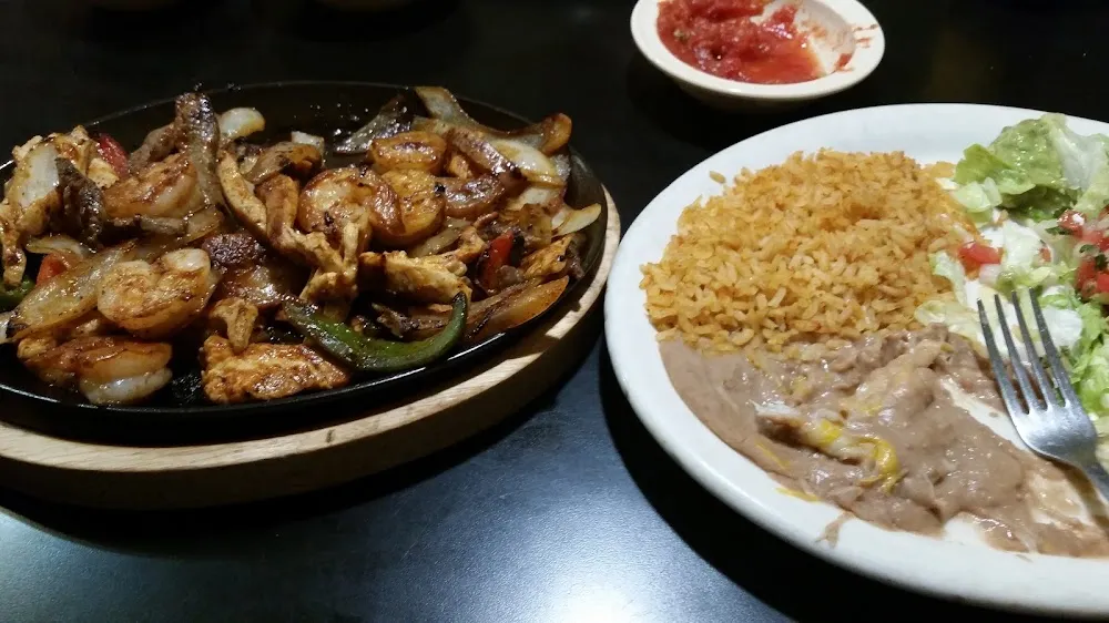 Shrimp Chicken and Steak Fajitas